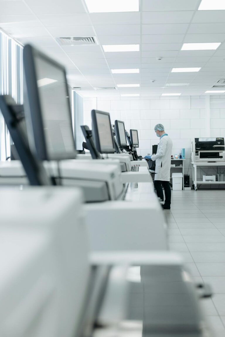 Medical professional in a modern lab using advanced equipment for research.